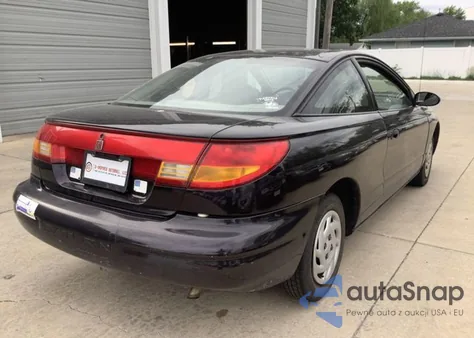 1999 Saturn Sc1 z USA, uszkodzony, nr VIN 1G8ZP1283XZ324457